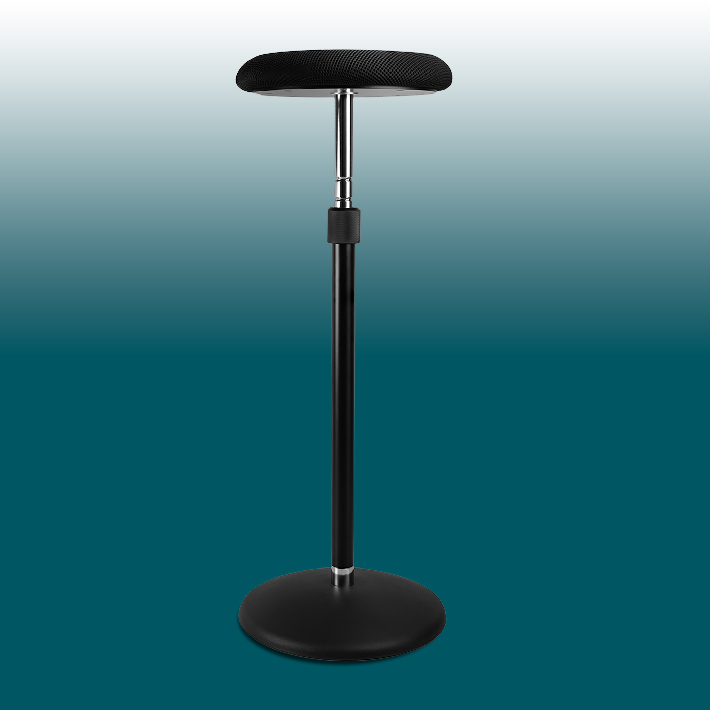 Height-adjustable Girsberger Sway standing seat with a round, black mesh seat on a slender, chrome-plated gas spring. Sturdy black column on a flat, round base. Modern, ergonomic, provides relief during prolonged standing.