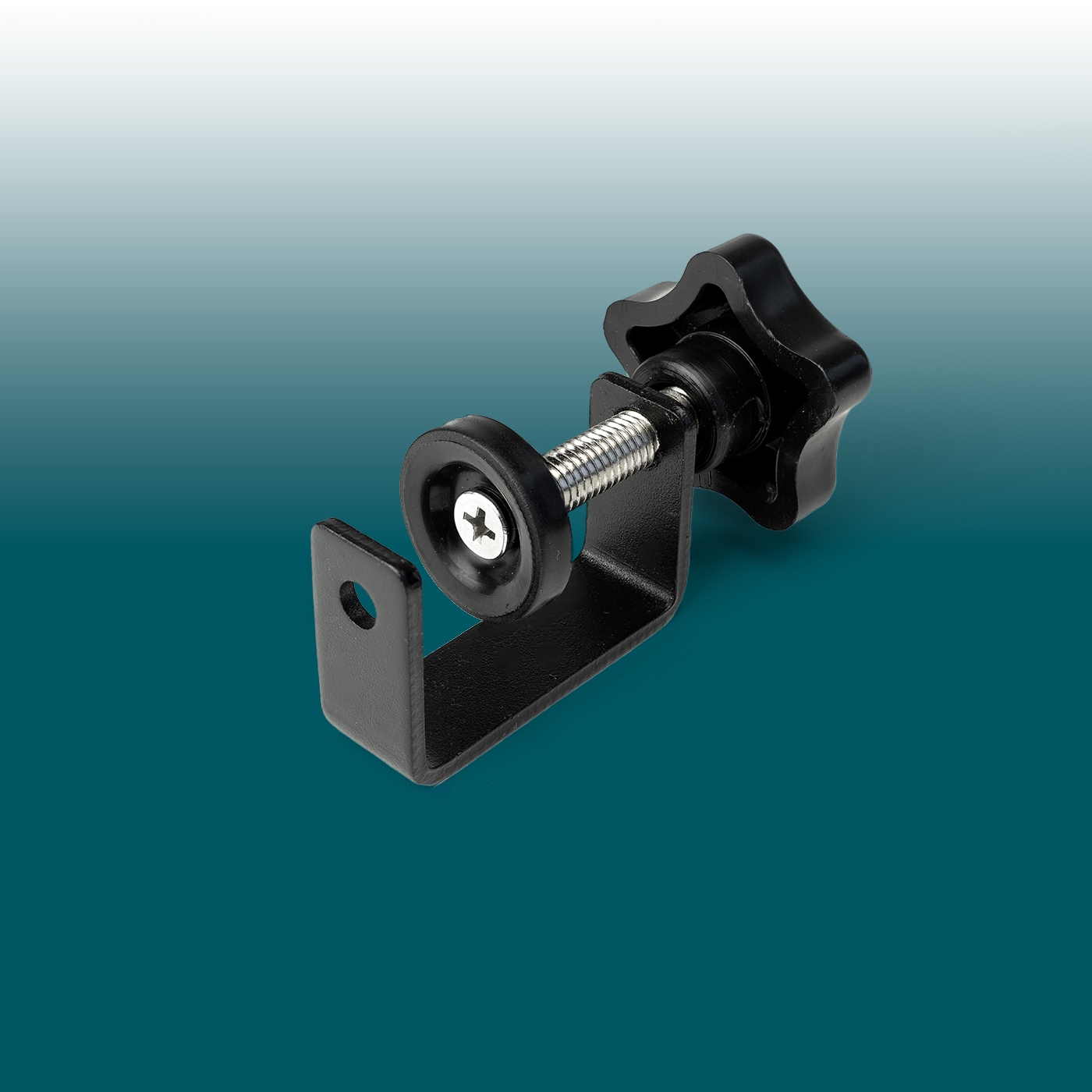 Black clamp mount with an L-shaped metal bracket, threaded bolt and star-shaped rotary handle. For secure mounting of the Desk2Device USB charger underneath the desk top, discreetly and sturdily. Hole visible.