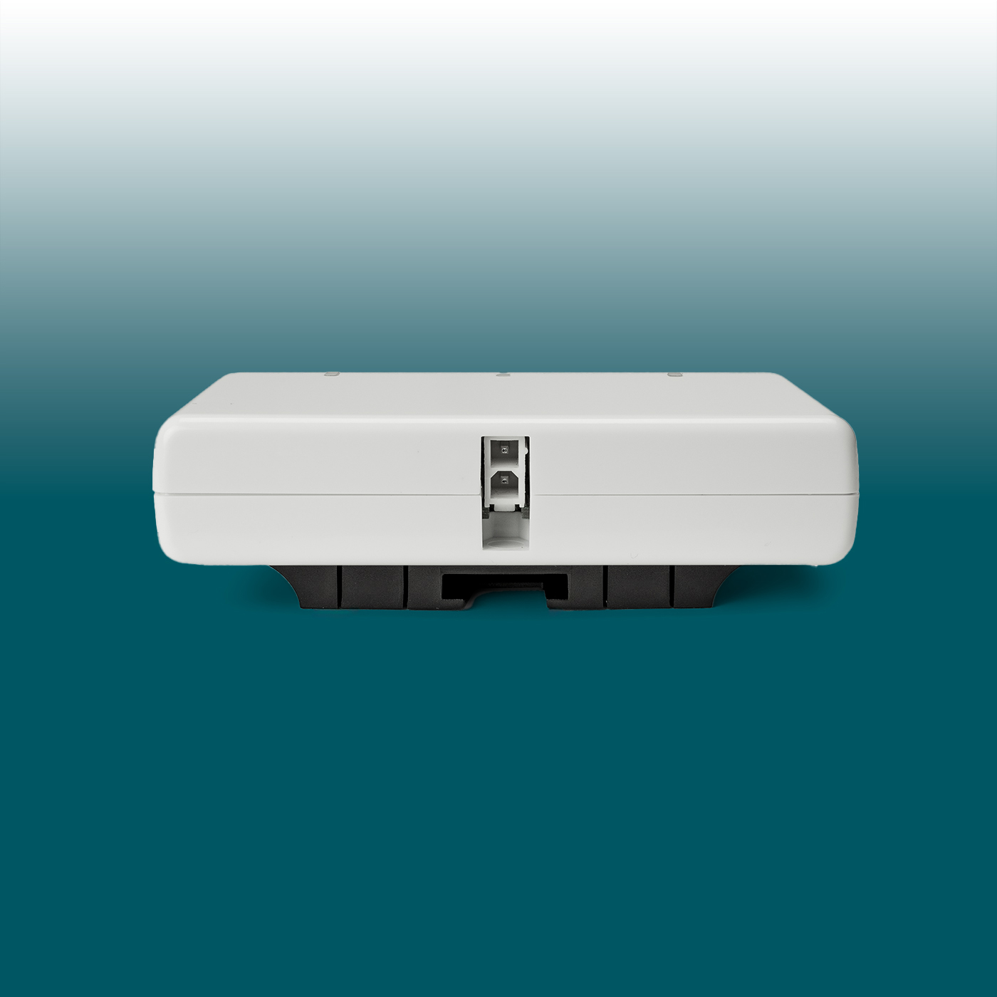 A slim, white USB charger, front-facing, with three ports in a central recess: two USB-C and one USB-A. Black mounting brackets at the bottom for discreet installation. Desk2Device charger.